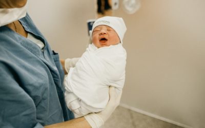 woman carrying baby